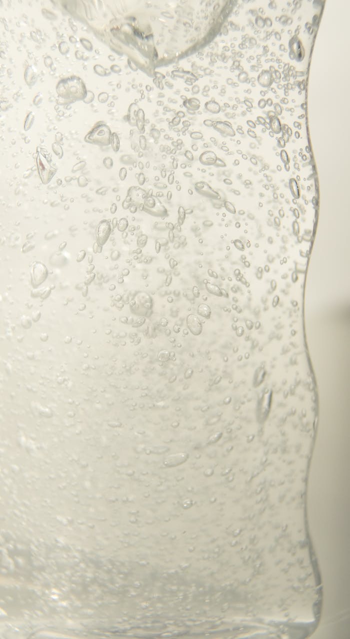 Close-up of carbonated water with vibrant bubbles, showcasing clarity and refreshment.