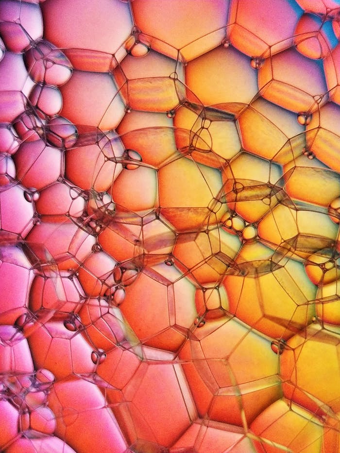 Colorful close-up of soap bubbles forming a vibrant abstract pattern.